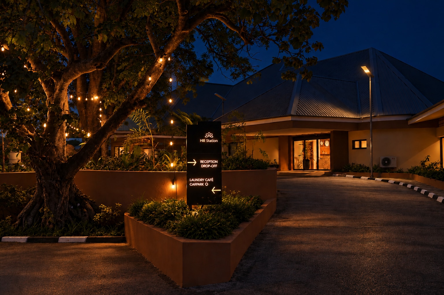 The Hill Station driveway lit in the evening